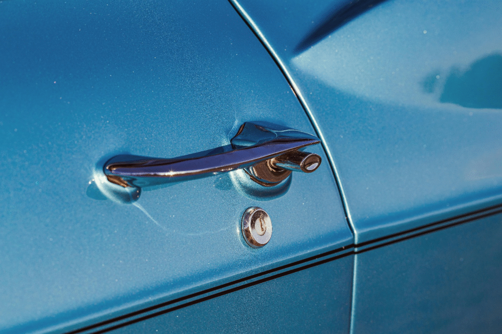 Closeup of lock on blue car door